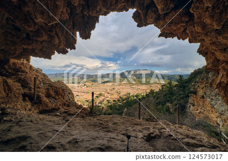 View of the exit from the cave in the mountains 124573017