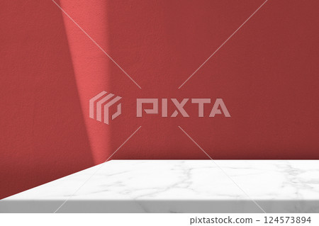 Marble Table with Light Beam and Shadow on Red Wall Background 124573894
