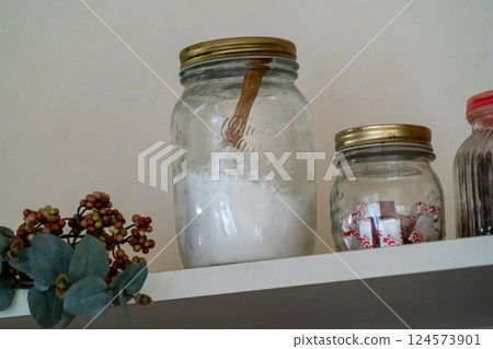 Potato starch stored in a glass jar on a kitchen shelf 124573901