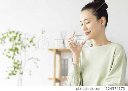 Diet woman drinking water Diet woman drinking water 124574173