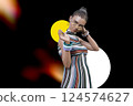 Stylish black woman wearing yellow glasses 124574627