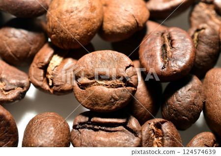 Coffee beans are lying on the table. Close-up. Coffee beans are lying on the table. Close-up. 124574639