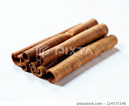 Aromatic cinnamon sticks on white background for culinary and decorative uses 124575146