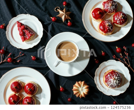 Festive coffee break with red berry pastries and seasonal decorations for holiday gatherings and celebrations 124575236
