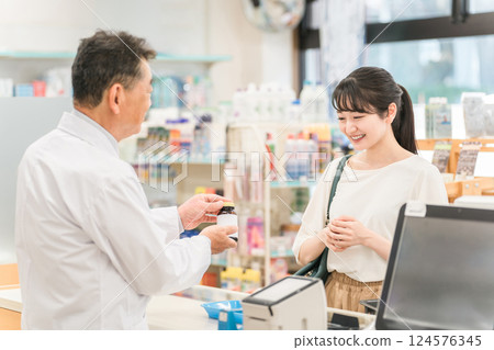 A woman who came to the pharmacy to receive a prescription and go shopping 124576345