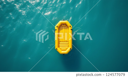 Yellow inflatable rescue boat floating on blue water, top view. Safety, survival, emergency, and maritime concept with copy space Yellow inflatable rescue boat floating on blue water, top view. Safety, survival, emergency, and maritime concept with copy space 124577079
