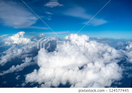 Aerial view of fluffy clouds over the Pacific Ocean in Polynesia 124577445