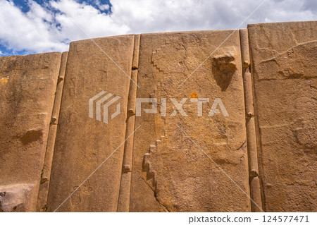 Ancient stone wall at the Inca fortress of Ollantaytambo, Peru 124577471
