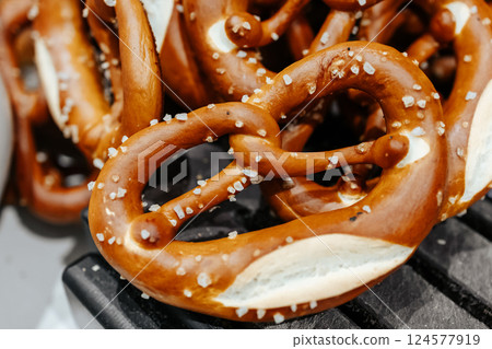 Pretzels with salt closeup. Fresh though nonsense on the store counter. Became business, brad trade. 124577919