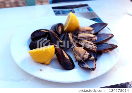Plate of Turkish stuffed mussels, also known as "Midye Dolma" Plate of Turkish stuffed mussels, also known as "Midye Dolma" 124578014