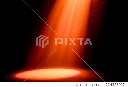 Stage spotlight with warm orange beam illuminating dark empty scene, dramatic theater lighting effect, focused light in black background, performance concept, artistic glow, isolated illumination Stage spotlight with warm orange beam illuminating dark empty scene, dramatic theater lighting effect, focused light in black background, performance concept, artistic glow, isolated illumination 124578032