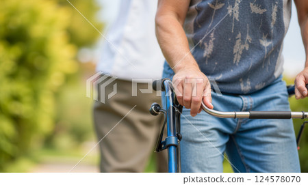 Adjustable mobility walker for elderly and injured individuals, promoting safe recovery and physical therapy support, featuring durable lightweight frame and comfortable handgrips 124578070