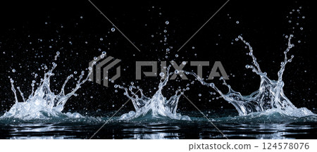 Water splashes in motion captured in high-speed photography, clear liquid droplets on black background, artistic fluid dynamic patterns 124578076