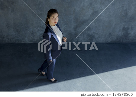 A woman in walking suit shape A woman in walking suit shape 124578560