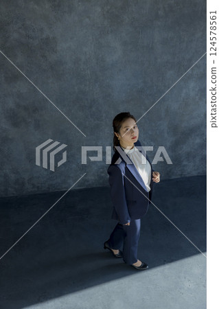 A woman in walking suit shape A woman in walking suit shape 124578561