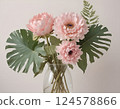 Pink Peony Bouquet with Monstera Leaves in Glass Vase 124578866