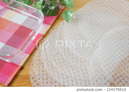 Rice paper and a bowl of water | Image of soaking rice paper in water Rice paper and a bowl of water | Image of soaking rice paper in water 124579918