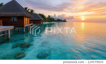 Overwater Bungalows in a Crystal-Clear Turquoise Lagoon with Stunning Sunset View 124579935