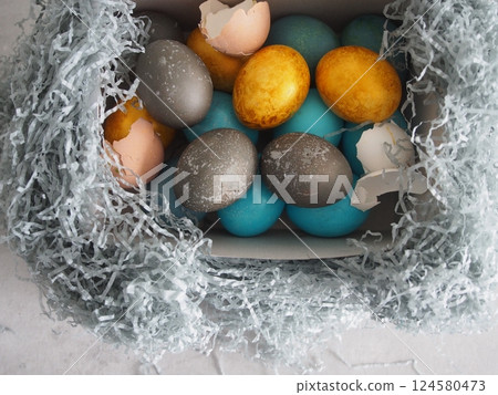 Bright Eggs laid out in nest 124580473
