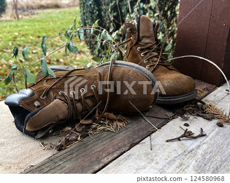 Earthen Explorers: Boots Weathered by Nature's Path Earthen Explorers: Boots Weathered by Nature's Path 124580968