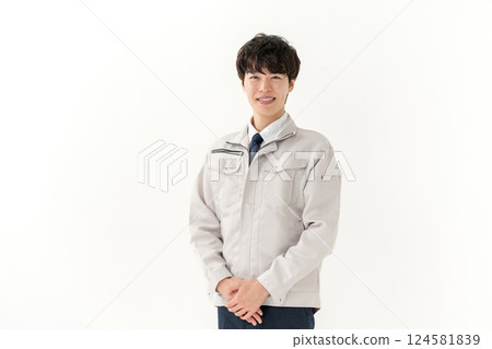 A young man working on clothes A young man working on clothes 124581839