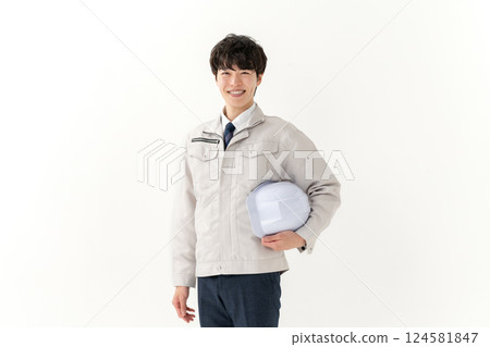 A young man working on clothes 124581847