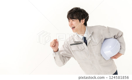 A young man working on clothes 124581856