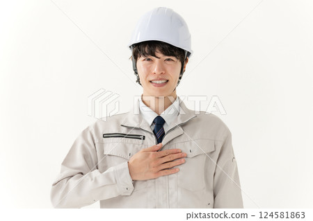 A young man working on clothes 124581863