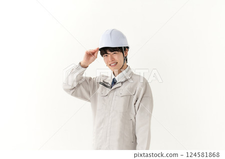 A young man working on clothes 124581868