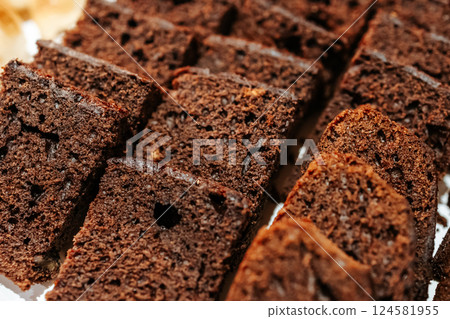 Juicy cocoa muffin. Bakery counter. Small business, trade in sweet confectionery. Chocolate sweets. 124581955