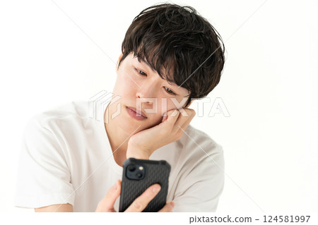 Men looking at smartphones Men looking at smartphones 124581997