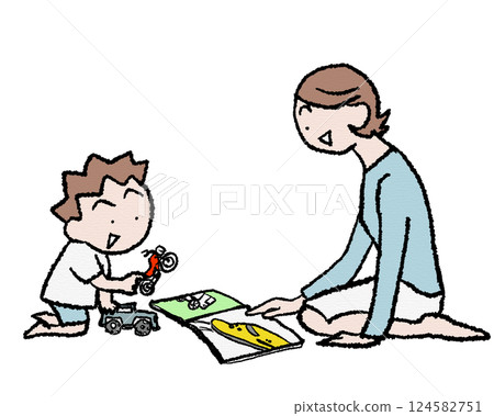 A boy playing with car and motorbike toys and a train picture book 124582751