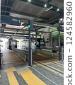 A train arriving at the station platform 124582960