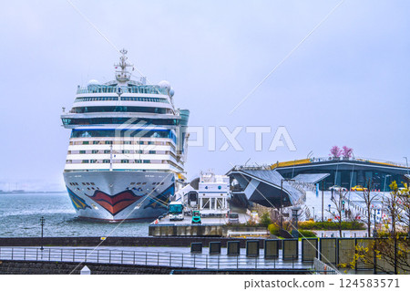 Yokohama cityscape in Japan. The AIDA Stella, which entered port for the first time, is anchored at Osanbashi Pier...rain. Winter cold returns...=April 1st 124583571