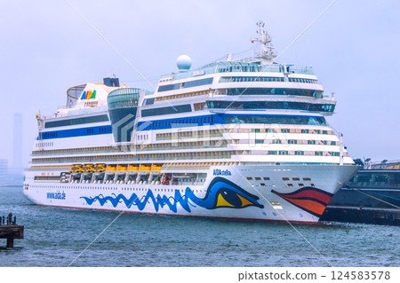 Yokohama cityscape in Japan. The AIDA Stella, which entered port for the first time, is anchored at Osanbashi Pier...rain. Winter cold returns...=April 1st Yokohama cityscape in Japan. The AIDA Stella, which entered port for the first time, is anchored at Osanbashi Pier...rain. Winter cold returns...=April 1st 124583578