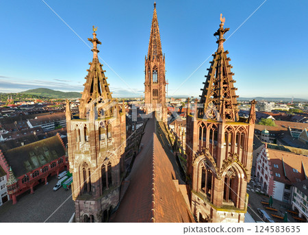 Freiburger Dom Close up Drone Shot made at Morning in Freiburg im Breisgau, Germany at Sunrise. Cathedral in Freiburg 124583635