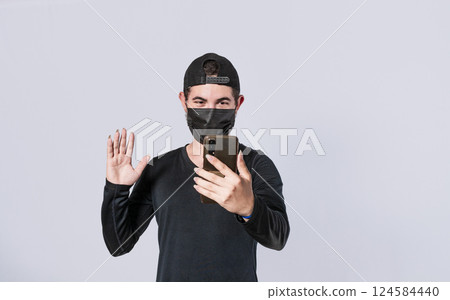 Man making video call isolated, guy making video call with face mask, face mask video call concept 124584440