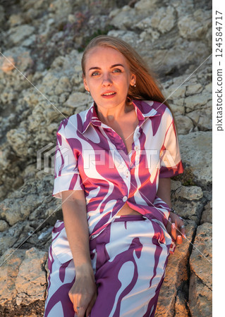 Beautiful slender blonde woman in silk suit Beautiful slender blonde woman in silk suit 124584717