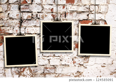 Photos hanging on paper clips against wall. Nostalgic Picture album with old photoframe. Template with three retro frame photos. Moodboard pictures album for scrapbooking. Vintage style mood board 124585091
