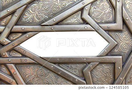 Frame with traditional islamic ornament. Antique copper backdrop and national moroccan floral pattern. Oriental ornaments with artistic with chasing for brass. Copy space for text. Isolated on white 124585105