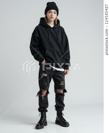 Urban streetwear fashion: edgy black hoodie and ripped jeans style for trendy youth 124585487