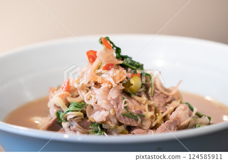 Thai Food, boiled with fried Pork cooked with Shrimp Paste in white bowl that ready to serve and eat. 124585911