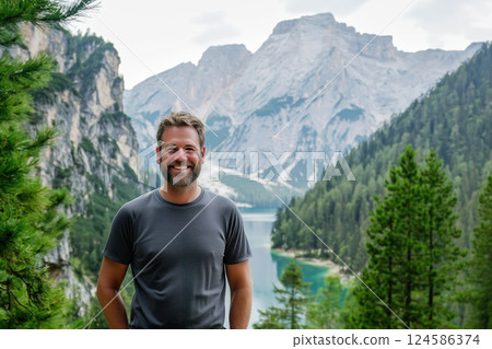 Happy man smiling at mountain viewpoint. AI-generated item 124586374