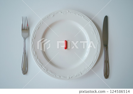 Single red capsule placed on white decorative plate with cutlery. AI-generated item 124586514