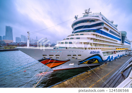 Yokohama cityscape in Japan. The AIDA Stella, which entered port for the first time, is anchored at Osanbashi Pier...rain. Winter cold returns...=April 1st Yokohama cityscape in Japan. The AIDA Stella, which entered port for the first time, is anchored at Osanbashi Pier...rain. Winter cold returns...=April 1st 124586566