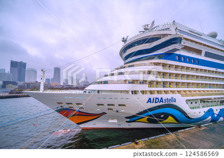 Yokohama cityscape in Japan. The AIDA Stella, which entered port for the first time, is anchored at Osanbashi Pier...rain. Winter cold returns...=April 1st Yokohama cityscape in Japan. The AIDA Stella, which entered port for the first time, is anchored at Osanbashi Pier...rain. Winter cold returns...=April 1st 124586569