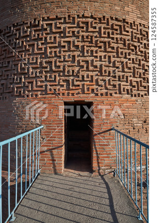 entrance to ancient minaret Burana Tower. Kyrgyzstan travel landmark entrance to ancient minaret Burana Tower. Kyrgyzstan travel landmark 124587355