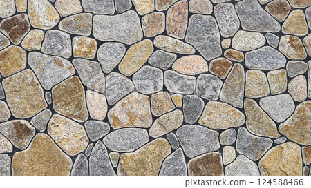 The background consists of steppe natural wild stone. A modern stone fence. 124588466