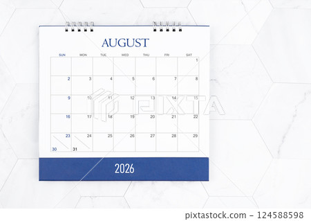 August 2026 desk calendar on white marble tiles background. 124588598