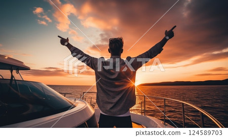Man wearing sunglasses and casual attire leaps with joy on the deck of a luxurious yacht, basking in the sunset and carefree travel lifestyle 124589703